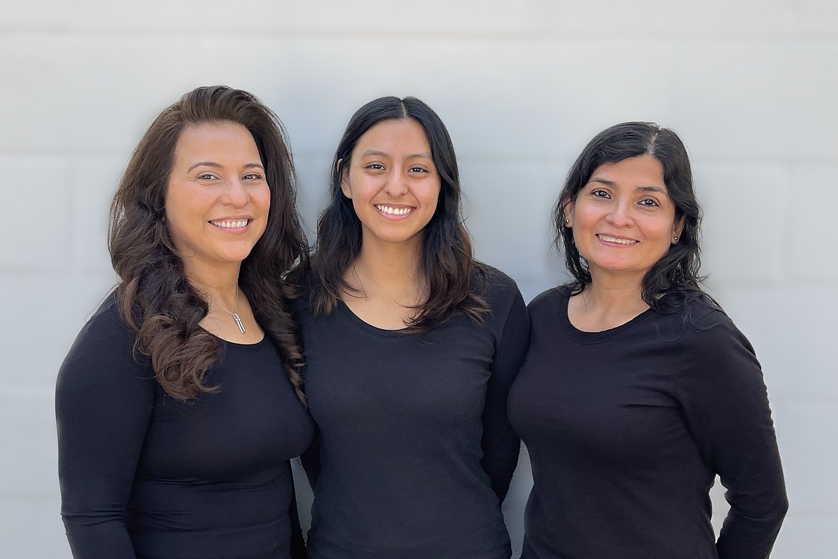 The J. Griffiths Dentistry team, smiling together outside the office